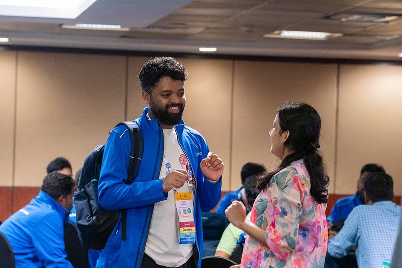 Two attendees deep in conversation between sessions
